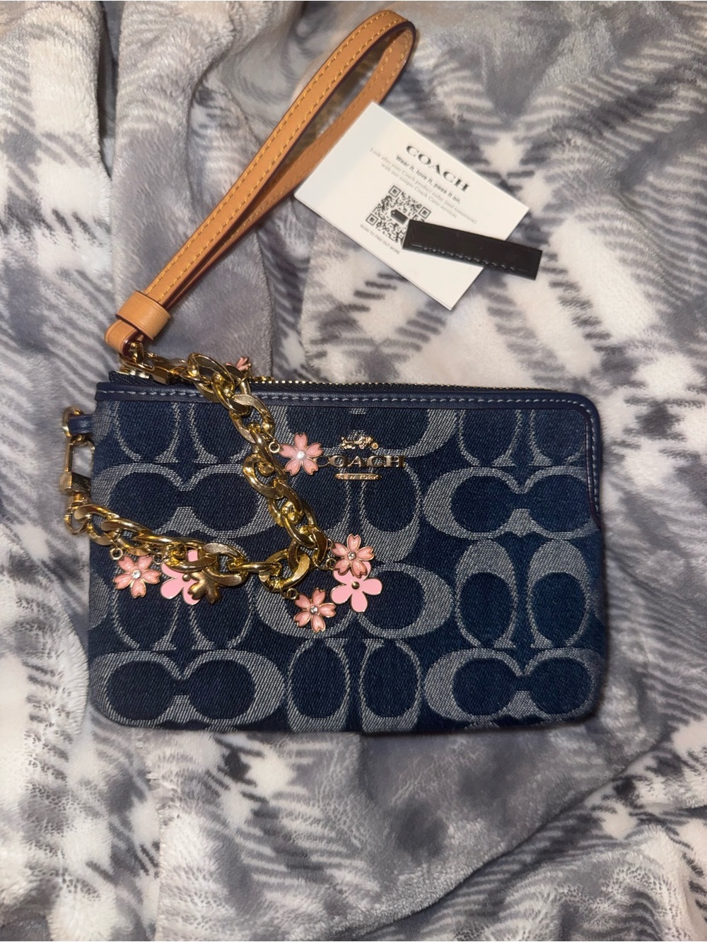 Coach Blue Denim Wristlet with Pink Floral Charm and Tan Strap